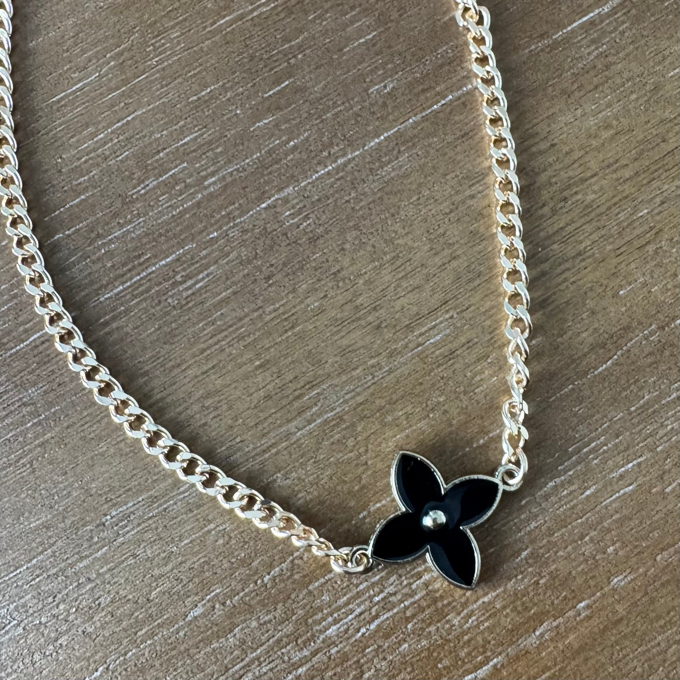 Black Flower and Gold Necklace