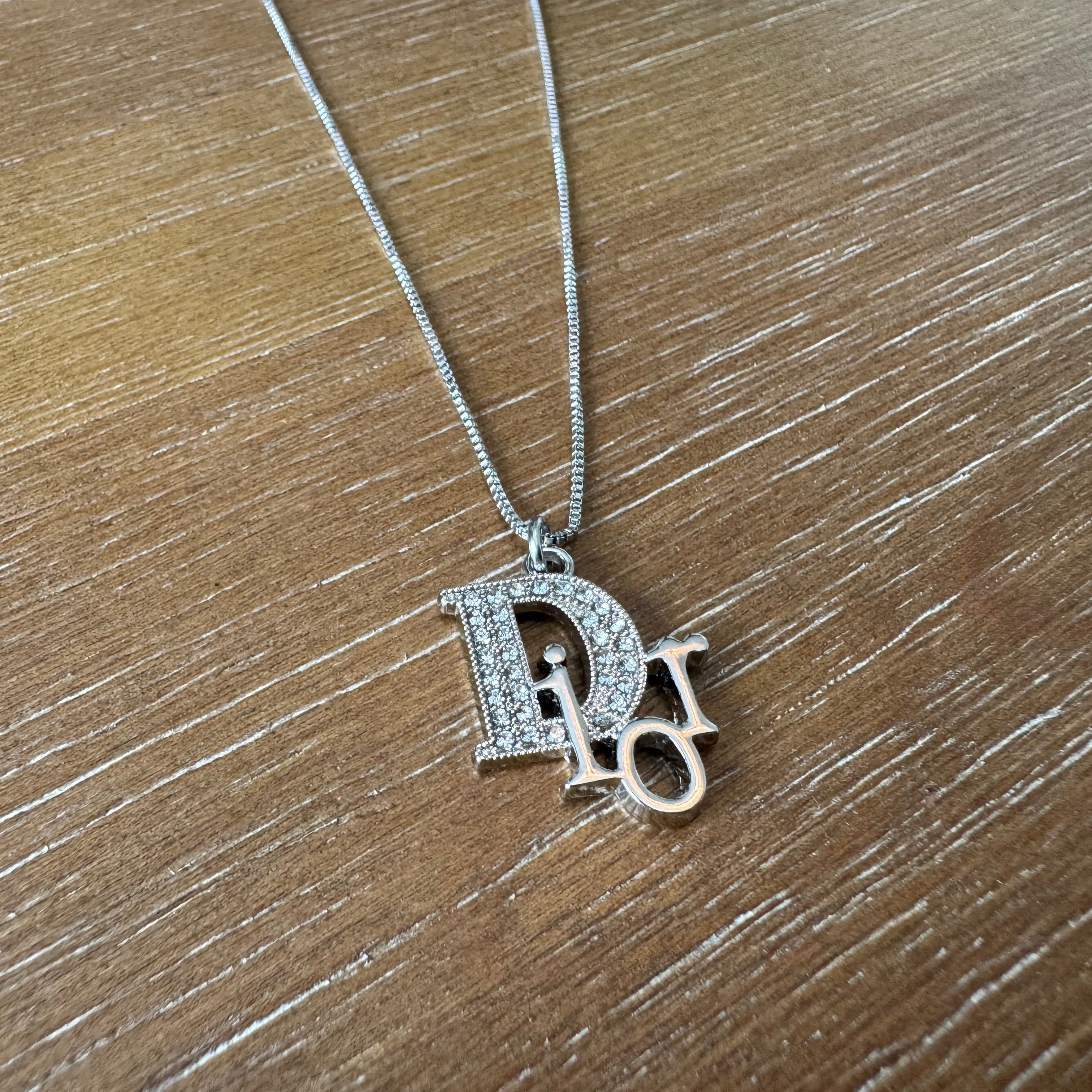 Silver and Rhinestone D Necklace